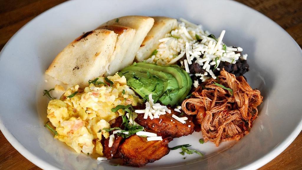 Desayuno Criollo * · Shredded beef, black beans, fried plantains with white shredded cheese, avocado and scrambled or fried egg, served with arepa.