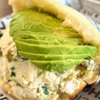 Arepa Reina Pepiada · Arepa stuffed with chicken salad mixed with avocado, green peas and chopped parsley in a may...