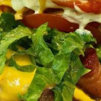 Doggis Burger · Smashed beef patty, cheddar cheese, bacon, lettuce, tomato, potato sticks and Doggi's sauces...