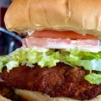 Chicken Sandwich · Golden brown breaded chicken thigh, lettuce, tomato and mayo-dijon sauce, served with fries