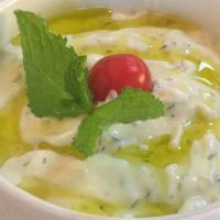 Tzatziki · Vegetarian. Greek yogurt, cucumber, garlic, mint, dill & extra virgin olive oil.