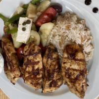 Chicken Kebab · Marinated grilled chicken breast. Served with Greek salad, rice & tzatziki.
