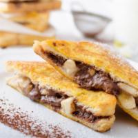 Chocolate Chip Nutella French Toast · 4 delicious slices of golden French Toast. Topped with chocolate chips, Nutella, a little bu...