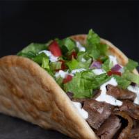 Super Gyro Wrap · Seasoned gyro, mushroom, Provolone cheese, lettuce, and z (gyro) sauce in a pita wrap.