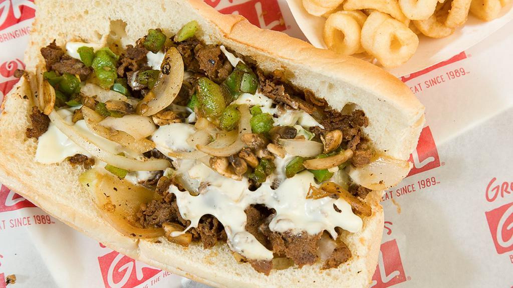 Philly Cheese Steak · Grilled Sirloin steak, white American cheese, grilled onions, green peppers, and mushrooms in hoagie bread.