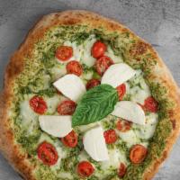 L'Italiana Pizza · Ricotta and pesto blend, cherry tomatoes, and mozzarella cheese. Topped with fresh mozzarell...