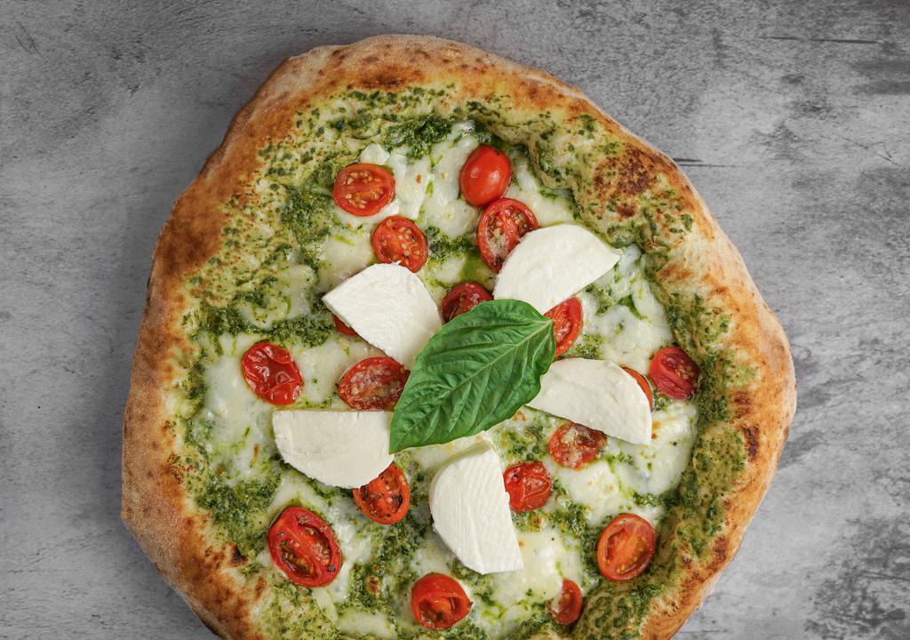 L'Italiana Pizza · Ricotta and pesto blend, cherry tomatoes, and mozzarella cheese. Topped with fresh mozzarella and basil.