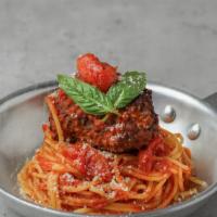 Spaghetti With Meatball · Spaghetti with tomato sauce and a large homemade meatball.