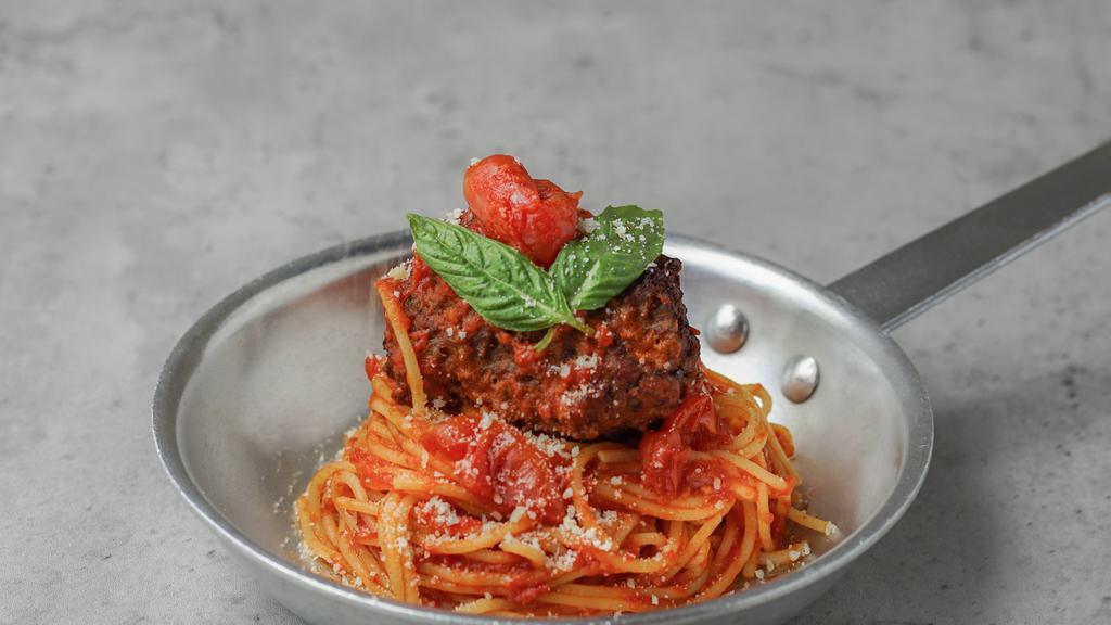 Spaghetti With Meatball · Spaghetti with tomato sauce and a large homemade meatball.