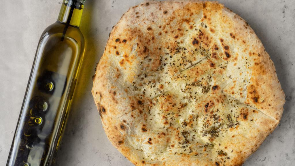Focaccia Bread · Freshly baked focaccia bread with olive oil and Italian herbs