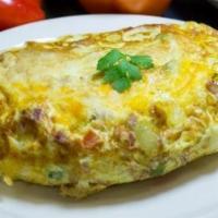 Veggie Omelette · Green and red peppers, onions sauteed with fresh and mushrooms.
