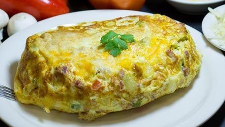Greek Omelette · Tomatoes, fresh spinach, and feta cheese. Served with pancake or toast.