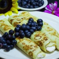 Blintz Crepe · French crepe batter wrapped around our special blend of farmer's cheese, sour cream, and a h...