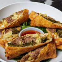 Soul Roll · Chefs elevated egg roll with mac & cheese, collard greens, with slow cooked braised short ri...