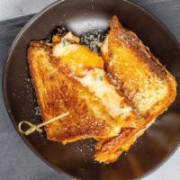 Blaqhaus Ultimate Grilled Cheese · Our buttery and fluffy Texas toast grilled to perfection oozing with four kinds of cheese an...