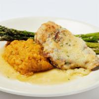 Parmesan Crusted Chicken · Marinated Chicken Breast finished with garlic butter and a parmesan topping served with choi...