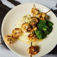 Grilled Shrimp Skewers · 10 jumbo shrimp flame grilled and finished with garlic butter. Served with choice of 2 sides