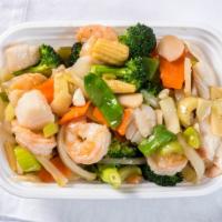 Seafood Delight · Jumbo shrimp, fresh scallops, crab meat with straw mushrooms, snow peas, baby corn, bamboo s...