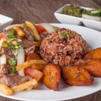 Lomo Saltado · Sauteed Beef with Tomatoes, Onions, French Fries and Seasoned with Soy Sauce.
