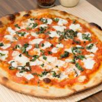 Margherita Napolitano · The finest buffalo mozzarella cheese, san marzano tomato sauce, topped with garden grown bas...