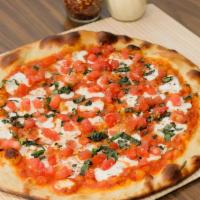 Caprese Pizza · San marzano tomato sauce, the finest buffalo mozzarella cheese, fresh diced tomatoes, and ga...