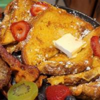 Frech Toast · 2 slices of french toast topped with whipped honey butter powder sugar and whipped cream & c...