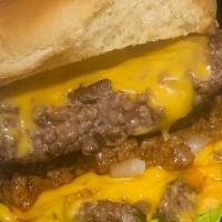 Chef Ki'S Killer Burger · One juicy, seasoned half-pound patty, topped with Cheddar cheese. Served with lettuce, tomat...