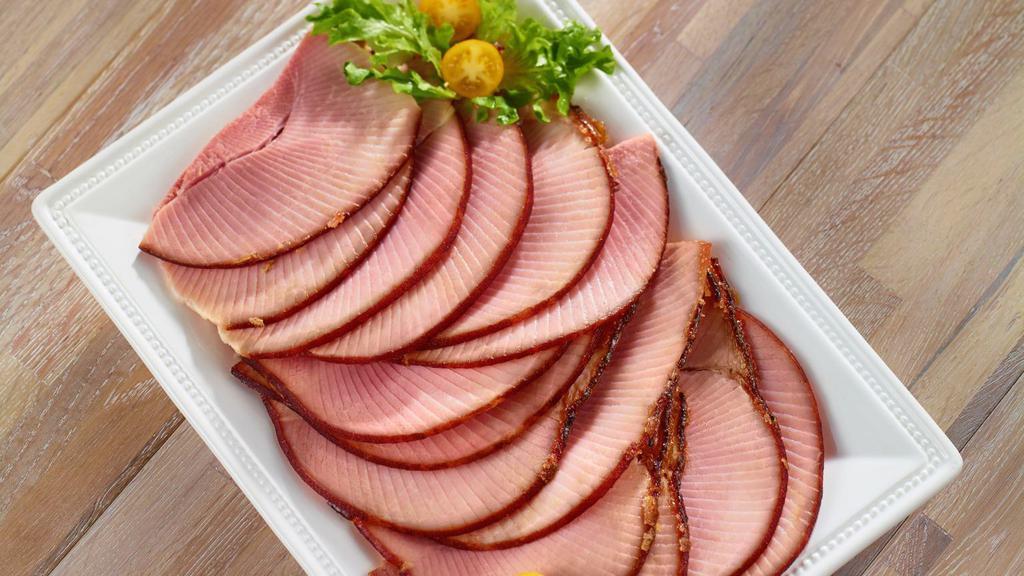 1Lbs Sliced Ham Bogo · Two pounds of our world-famous Honey Baked Ham, cut straight off the bone for you. Our sliced ham will have glaze, but it may need to be removed if there is too much fat on the edge for our expectations.