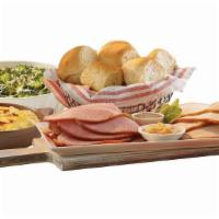 By-The-Slice Suppers - 1 Lb Ham Or Turkey · Serve our new by-the-slice suppers any night of the week! This meal features one lb. of Hone...