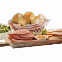 By-The-Slice Suppers - 1/2 Lb Ham Or Turkey · Serve our new by-the-slice suppers any night of the week! This meal features 1/2 lb. of Hone...