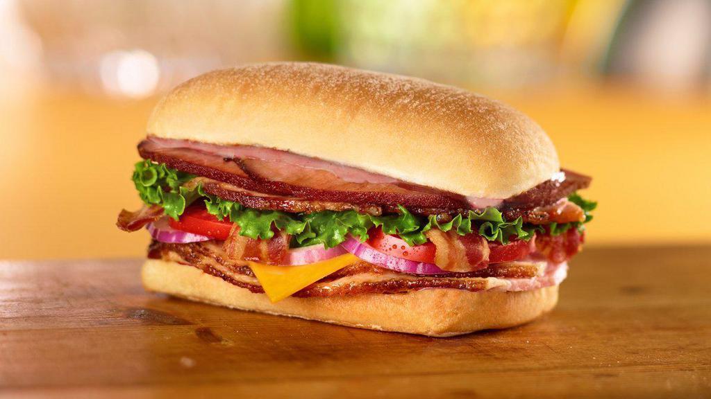 Bbq Smoked Stacker Sandwich · Toasted. Ham, bacon, Cheddar cheese, lettuce, tomato, red onion and smoky BBQ sauce on ciabatta.