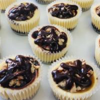 Turtle Cheesecake Minis - 4Ct · Our marbled chocolate ganache cheesecake topped with caramel, toasted pecans, and semisweet ...
