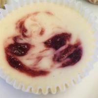 Vegan Strawberry Swirl Cheesecake Minis · Fresh,  sweet strawberry compote in our classic Vegan cheesecake recipe.  Baked on a vegan g...
