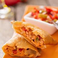 Chicken Empanada (1) · Delicious dough pocket filled with our seasoned chicken and fried to perfection.