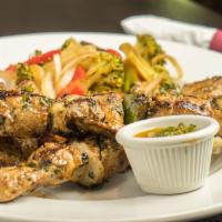 Premium Chicken Skewers (8 Oz.) With Two Side · Gluten-free. Hormone-free chicken breast marinated w/ grilled onions, peppers & fuegomundo.