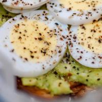 Protein Toast · Avocado paste, sliced eggs, black pepper and olive oil.