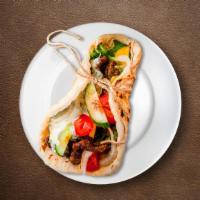 Gyro Sandwich · Slice of fresh beef and lamb. Served with lettuce, tomato, and onion topped with tzatziki sa...