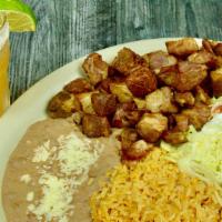 Carnitas · Mexican styled pork tips served with refried beans, rice, salad, and three tortillas.