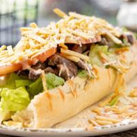 Pepito · Beef, chicken or both, cheese, lettuce, tomato, and crispy fries, mayonnaise, and ketchup.