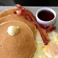 Buttermilk Pancakes · Served with 2 large eggs cooked any style and choice of hickory-smoked bacon, pork sausage o...