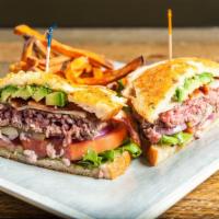 San Francisco Burger · On a grilled garlic-Parmesan sourdough with avocado, Swiss cheese, hickory-smoked bacon, gre...