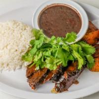 Asado Negro Especial Con Dos Acompanantes Y Un Petite · Pot roast, in a semi-sweet sugar cane sauce, with two side orders, and petite bread. Your ch...