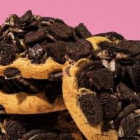 Cookies & Cream · Signature dough mixed with chocolate chips and topped with chunks of crunch Oreos.