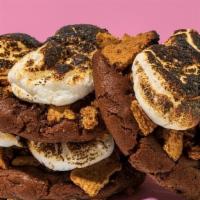 Chocolate S'Mores · Signature chocolate dough mixed with milk chocolate chips. Topped with crisp graham cracker ...