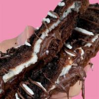 Nutella Oreo Cheesecake · Signature chocolate dough mixed with nutella and homemade cheesecake filling. Topped with Or...