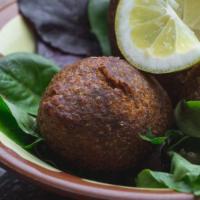 Kibbe · Crushed wheat blended with meat and stuffed with onions, pine nuts and ground meat.