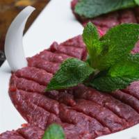 Kibbe Nayeh · Fresh raw meat blended with crushed wheat and spices.