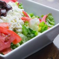 Greek Salad · Lettuce, tomato, cucumber, green pepper, black olives, onions topped with feta cheese and se...