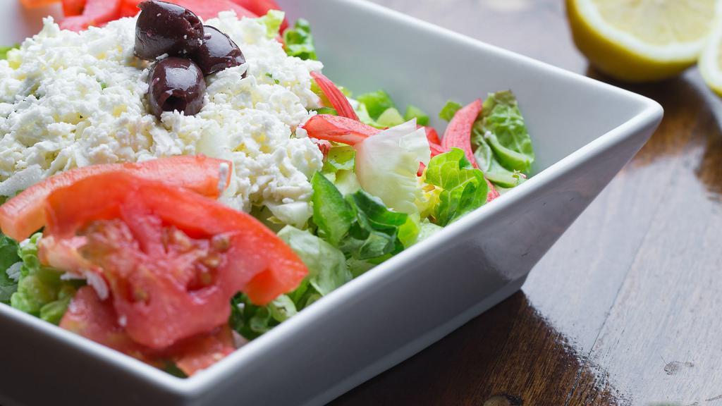 Greek Salad · Lettuce, tomato, cucumber, green pepper, black olives, onions topped with feta cheese and served with our house dressing.