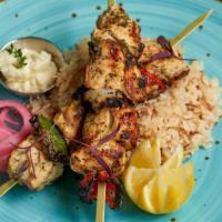 Chicken Kabob (Shish Tawook) · Two skewers of boneless, skinless marinated chicken breast served with angel hair rice and m...